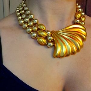 Chunky vintage gold toned necklace with shape of seashell and beads